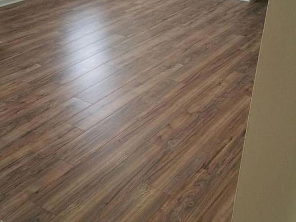 Laminate flooring in livingroom and master bed.