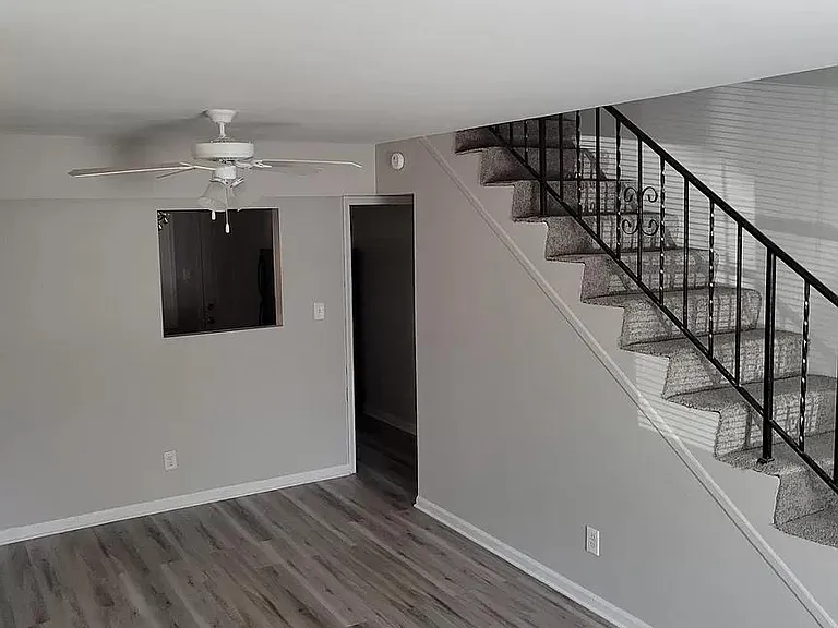 Stairs to upstairs with new carpet.