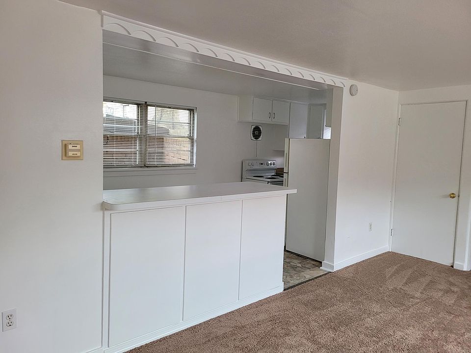 view from living room into kitchen/ eat-in area