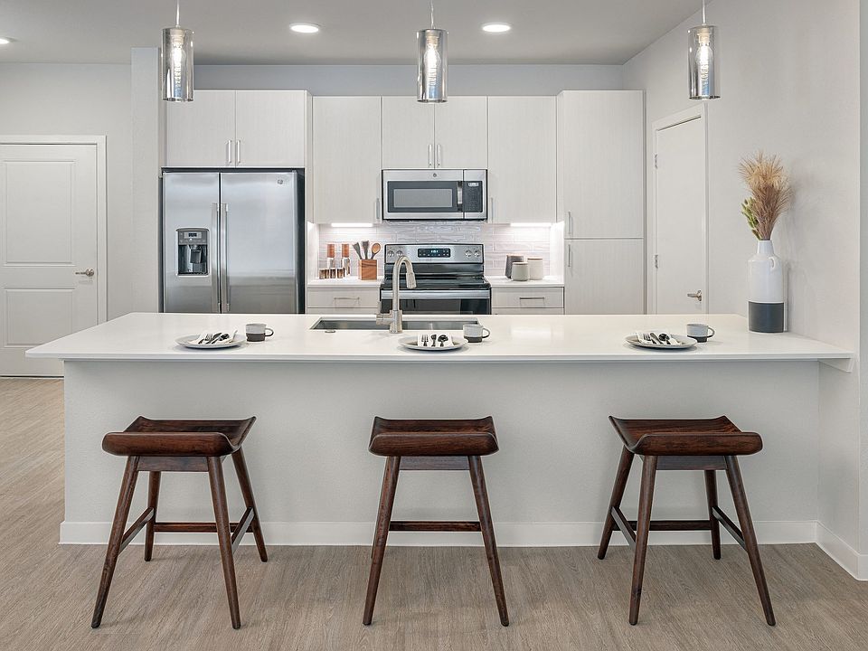 Stunning kitchens feature quartz countertops and subway tile backsplash