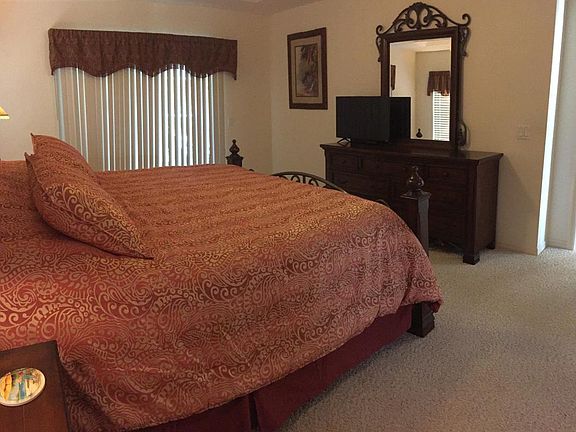 MASTER BEDROOM WITH KING SIZE BED AND HDTV.