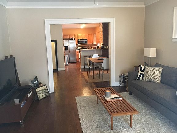 Another view of living, dining and kitchen areas