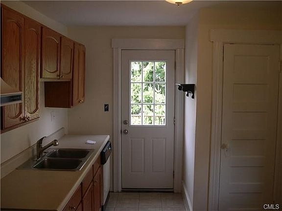 Eat-in Kitchen with Pantry Closet and Door to Deck.