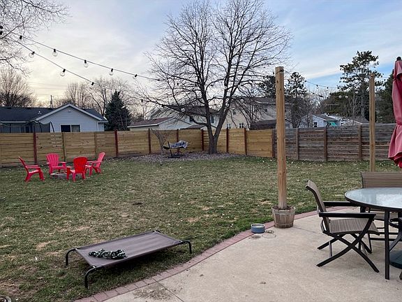 Large fenced in yard and firepit. Shed not pictured. Furniture not included.
