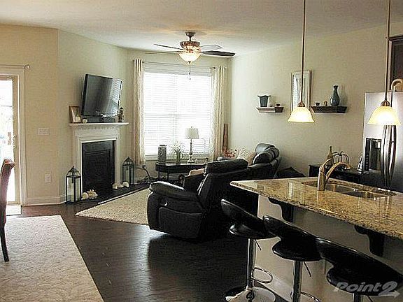 Large living room with cozy gas-log fireplace for those chilly fall and winter evenings