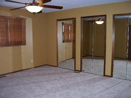 Master bedroom with full wall closet.