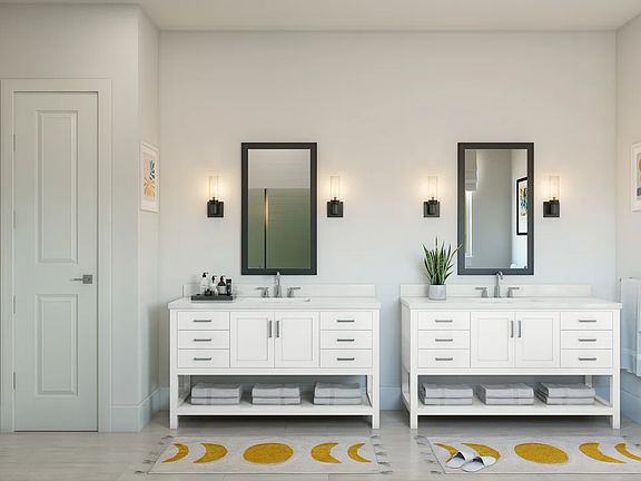 Primary bath with dual freestanding vanities