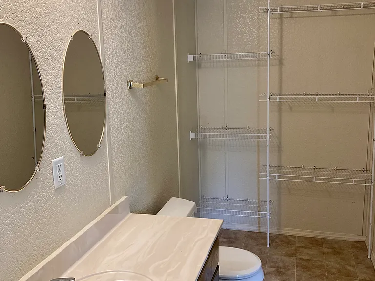 large bathroom at other end of home from master bath