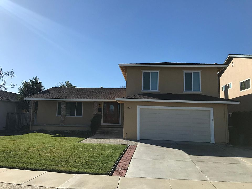 Freshly painted exterior, new double-paned windows, and gorgeous wood entry with side glass panels!