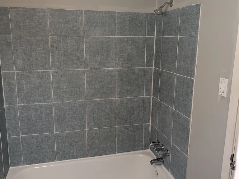 Master bathroom new tile + tub