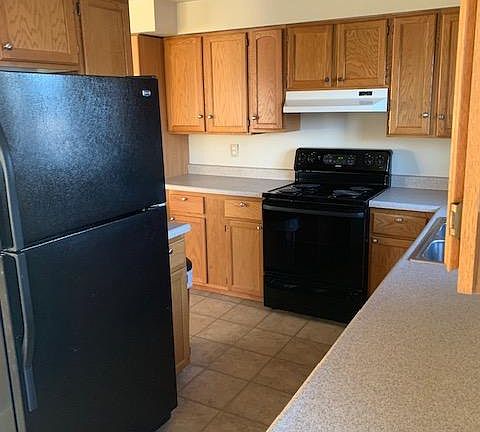 Nice Kitchen with stove/oven, refrigerator, dishwasher, microwave, and all cooking and dining utensils.