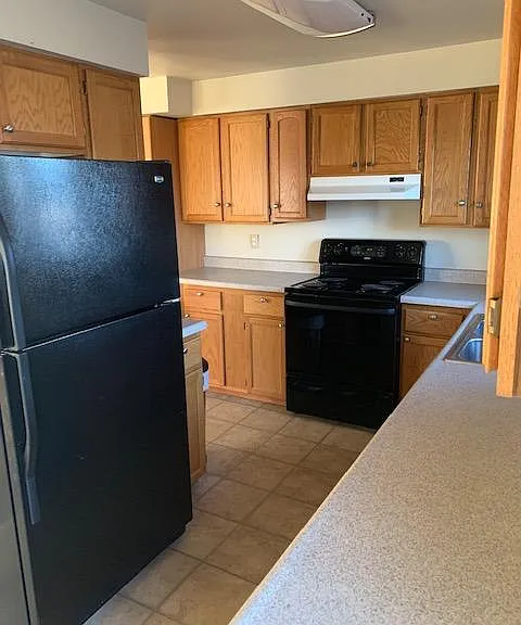 Nice Kitchen with stove/oven, refrigerator, dishwasher, microwave, and all cooking and dining utensils.