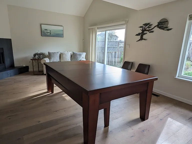 The pool table converts to an elegant dining room table with table top sections.