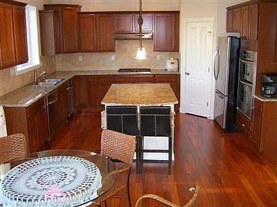 Cherry cabinets, slab granite counters
