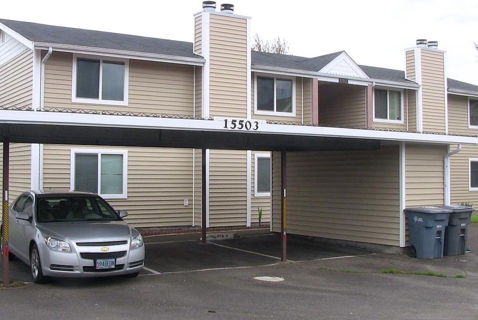 Building front view with 4 spaces carport