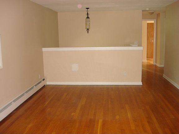 Formal living room with hardwood flooring