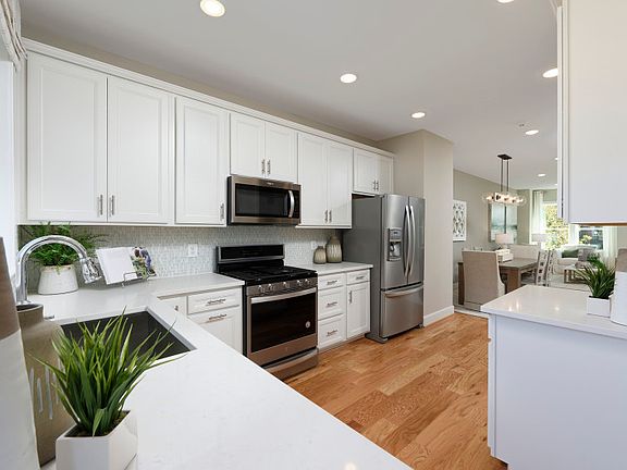 Model Representation - Stunning Kitchen with Quartz Counters and Whirlpool Stainless Steel Appliance