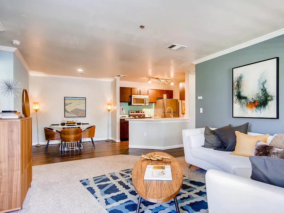 A Living Room and Kitchen at Eagles Landing at Church Ranch Apartments