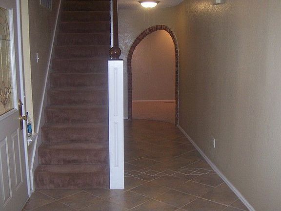 Beautiful archway into den.