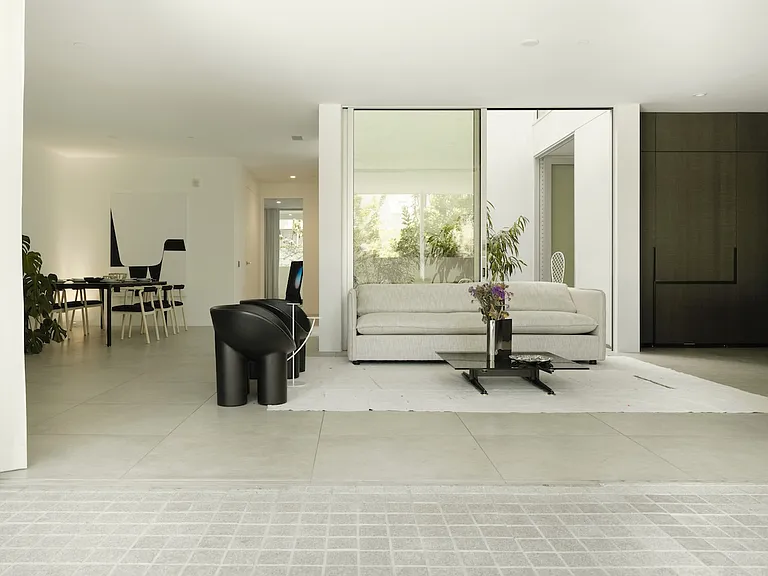 Open-Concept Living Area - Thoughtfully designed to enhance flow and comfort, this sophisticated layout features a seamless transition between indoor and outdoor spaces and a calming neutral palette.