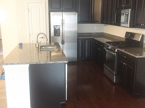 Kitchen - gas stove/oven, microwave, dishwasher, garbage disposal, side-by-side refrigerator, freezer, pantry and kitchen cabinets.