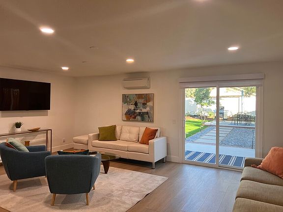 large TV,s seen from kitchen and dining