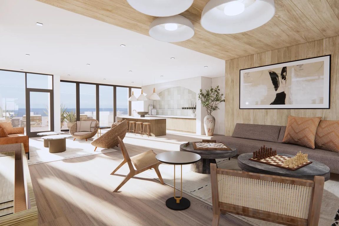 Sky lounge with ocean views, comfortable seating, and outdoor terrace at Modera Revere Beach apartments near Boston.