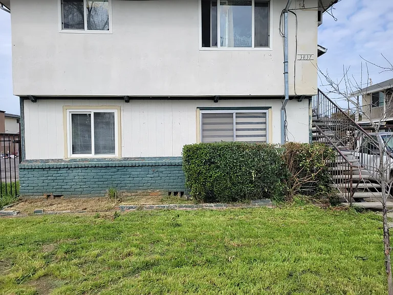 Outside of building. You can see the Zebra blinds in the front window by the bush. That would be your unit.