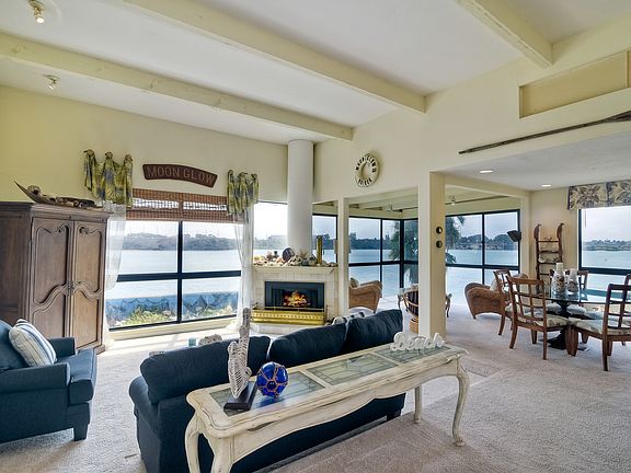 California casual furnishing, high ceilings, corner tv cabinet has been replaced by large screen TV