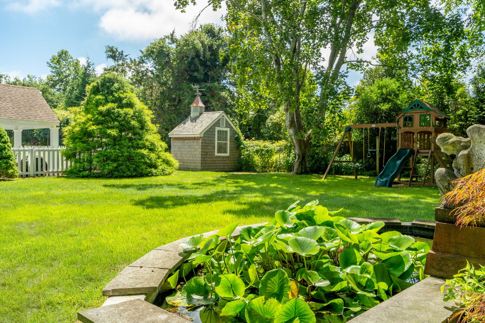  pond and lawn in backyard
