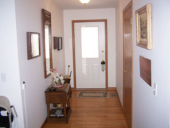 Oak floored foyer.