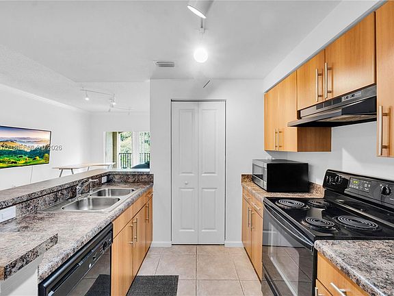 4th image of 5880 W Sample Rd APT 203