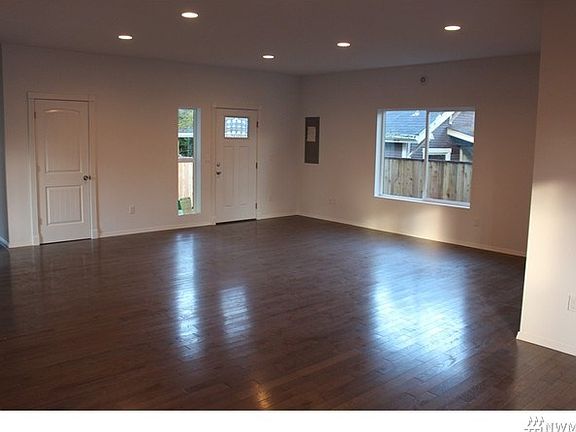 Welcome home - Huge open great room with beautiful wood floors, perfect for entertaining.