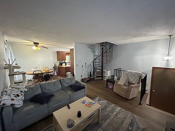 Open concept - Living room, dining room, kitchen, and then spiral staircase leading upstairs to bedroom #1