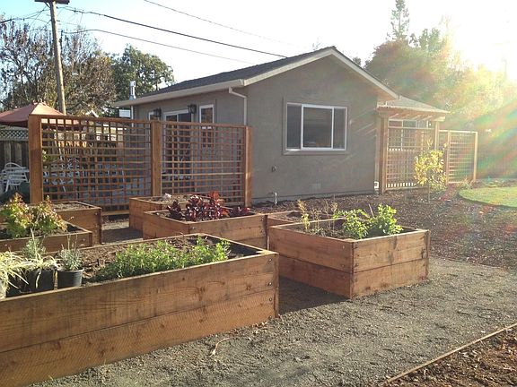 Organic vegetable garden & back of cottage - private patio behind cottage