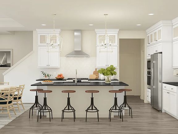 Kitchen with pendant lighting and glass upper cabinets