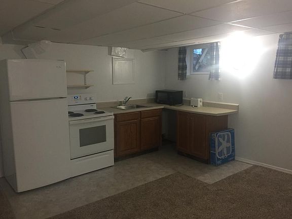 Kitchen includes a microwave, toaster, stove and refrigerato