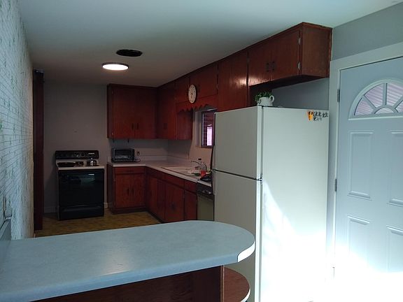 Kitchen with door to sunroom