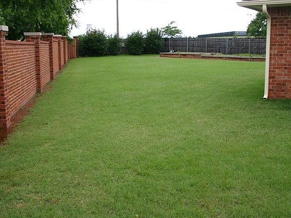 Backyard with Brick Fence