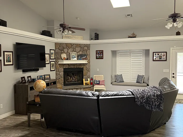 Bright, open living space with updated vinyl flooring throughout.