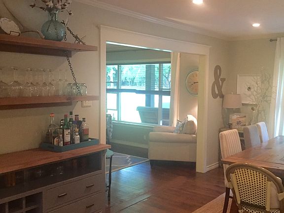 Kitchen opening into dining/living room