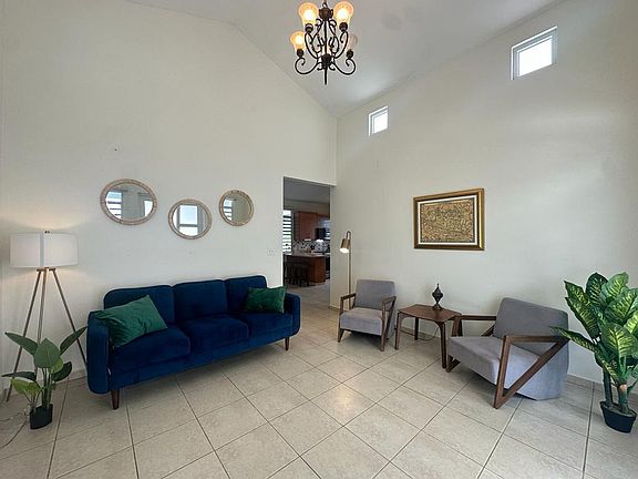 Entrance room with 15-ft ceilings. Faces east. Entrance from front door and from garage.