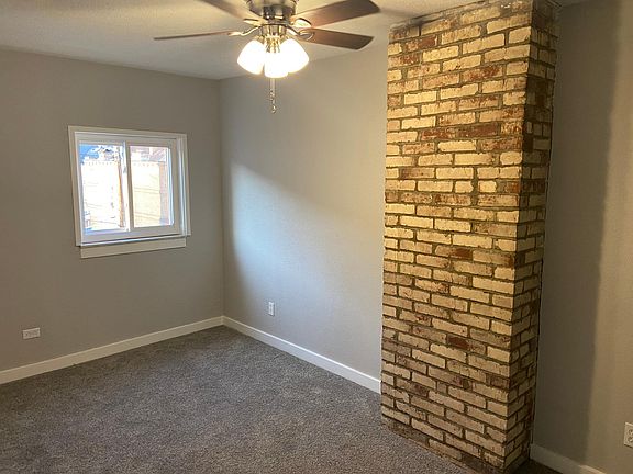 3rd floor bedroom with exposed brick
