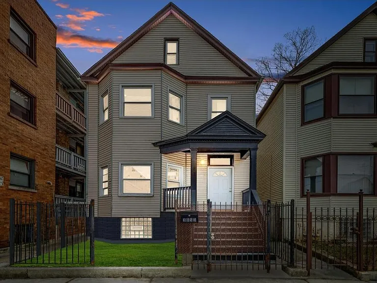 Beautiful building with gated privacy fence.