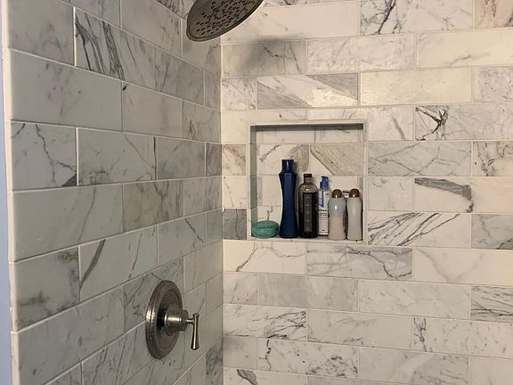 Master bath - shower redone in Calacatta marble