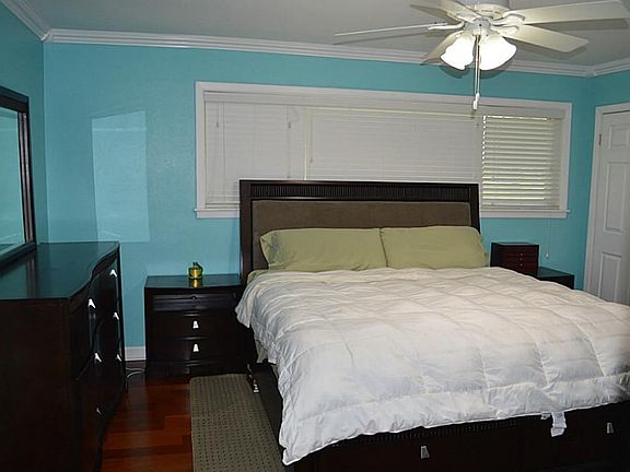 Master Bedroom - The master bedroom offers a huge, spacious space with beautiful hardwood flooring, 
