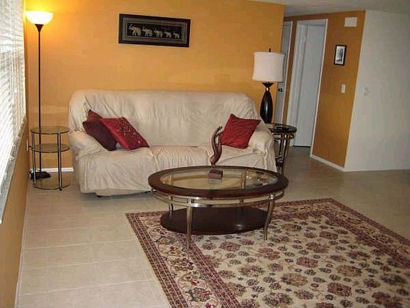Large tiled living room.