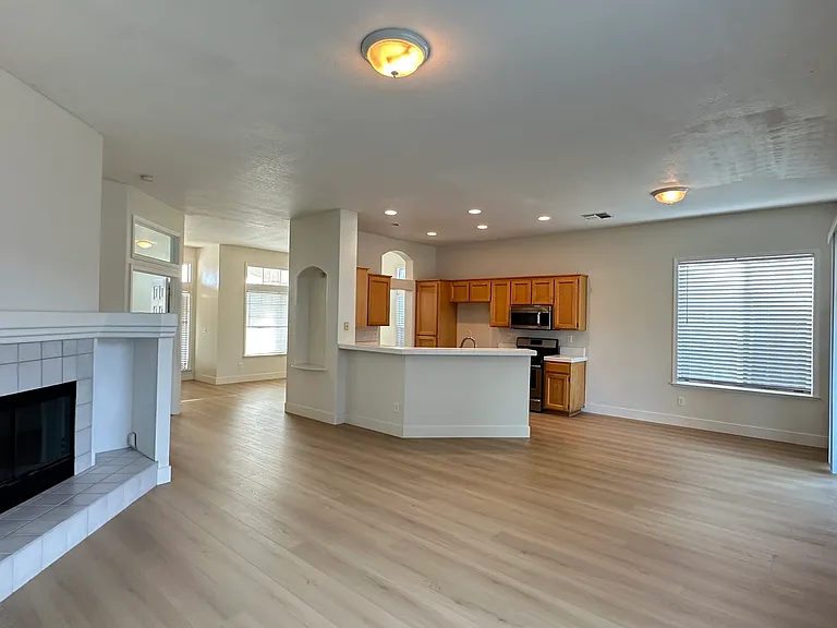Family room with large window and fireplace