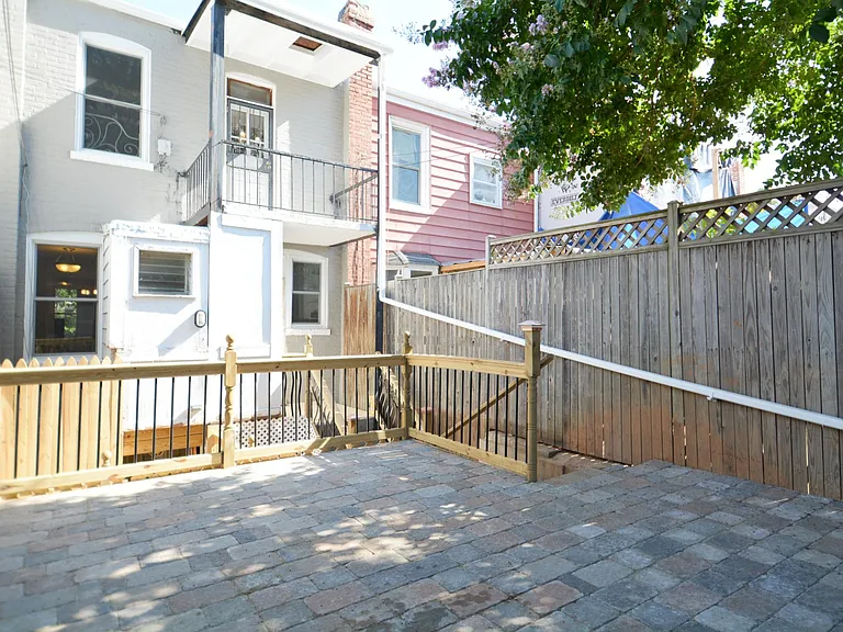Parking/patio area. Room for two cars.