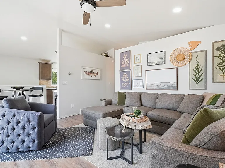 Family room w/ TV on the upper level.
